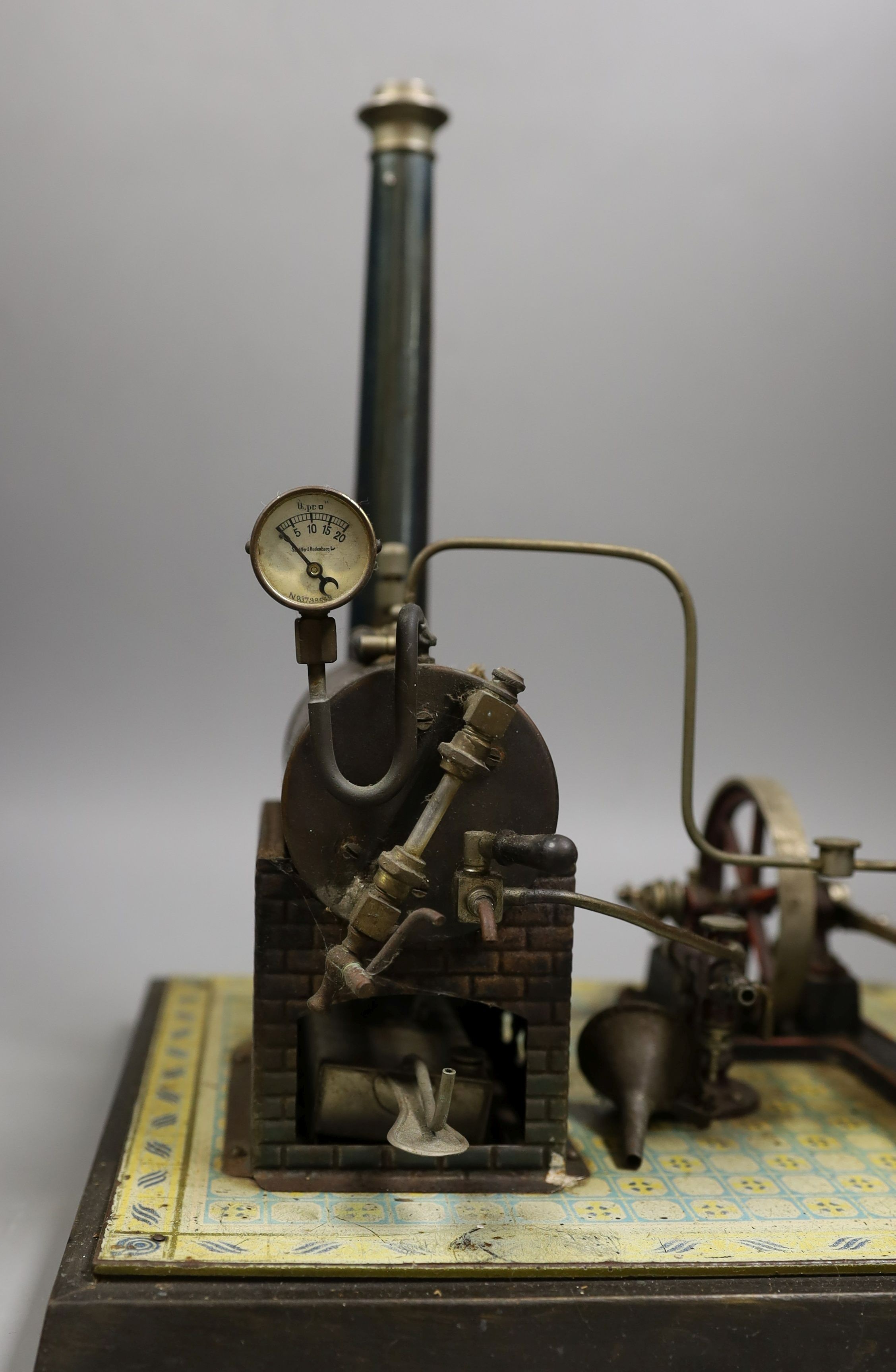 Gebruder Bing - tinplate stationary steam plant, single cylinder, rare, in original pine box, and grindstone accessories, 32cms high, width - 16cm, length - 29cm